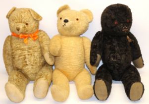 Mid C20th large black teddy bear, and two similar sized blonde bear