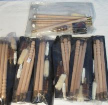Collection of seven 12B gun cleaning kits