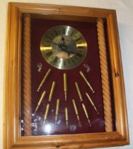 Mounted wall clock with cartridge display including 243 WIN 30/06 spring etc all inert 40cm x 50cm