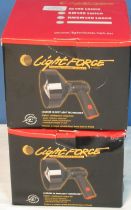 Two boxed LightForce portable spotting lamps
