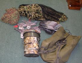 Large collection of NRA pigeon decoys, with ghillie and camouflage net, and Shell pigeon decoys with