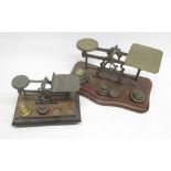 B.W.B.W. early C20th brass postage scales on shaped and moulded mahogany base with matched weights