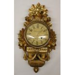 E.C. Qvarnstrom Stockholm - C20th Empire style gilt wall clock, the case embellished with garlands