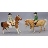 Beswick figures: boy on palomino pony No. 1500, and a girl on a skewbald pony No. 1499 (2)