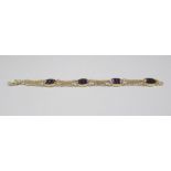 9ct yellow gold bracelet set with blue John and pierced panels, stamped 375, L17cm, 13.2g