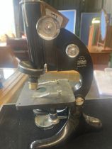 R. & J. Beck Ltd London - Model 29 japanned microscope on triform base, base repaired, serial no.