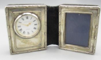 Kitney & Co., London - ERII silver desk top folding combination quartz timepiece - photograph frame,