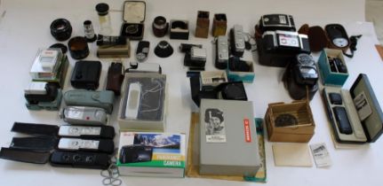 Selection of miniature cameras and selection of camera lenses, accessories, filters, light meters,