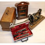 Jones walnut cased hand operated sewing machine serial no.314271, wall cabinet and a cased