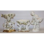 Two late C19th Moore Bros white-glazed figural groups/comports, one modelled as a girl carrying