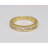 18ct yellow gold half eternity ring set with diamonds, stamped 750, size M, 5.5g