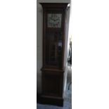 C20th continental oak long case clock, glazed door and square silvered Arabic dial with twin