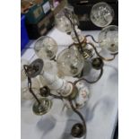 Dutch brass and ceramic five branch chandelier and a matching three branch chandelier, both with