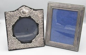 ERII embossed silver photograph frame with circular aperture, London 1989 H21.5cm and another