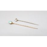 Yellow metal tie pin set with cabochon opal, stamped 240, 1.7g, and a white metal tie pin set with