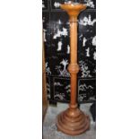 Large Victorian golden oak ecclesiastical candlestand, circular top on stepped circular base and