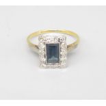 18ct yellow gold sapphire and diamond cluster ring, the rectangular cut sapphire surrounded by