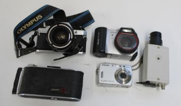 Olympus OM 10 camera with 28-70mm lens, Phillips VMC 7650 CCTV camera, Agfa Billy record folding