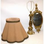 C20th gilt Rocco style table lamp H83cm and a C20th Neo Classical brass framed oval mirror H69cm (2)