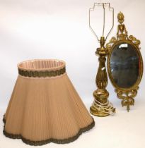 C20th gilt Rocco style table lamp H83cm and a C20th Neo Classical brass framed oval mirror H69cm (2)