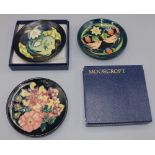 Moorcroft Pottery: three pin dishes, in Lamia, Strawberry Thief, and Oberon designs, all D11.5cm,