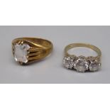 9ct yellow gold three stone ring set with clear stones, size N, and another 9ct gold ring set with a