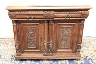 Edw. VII Gothic revival oak side cabinet, moulded top over two frieze drawers and two panelled doors