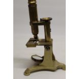 J.B. Dancer Manchester - C19th lacquered brass microscope on cast triform base bearing makers
