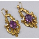 9ct yellow gold Rococo style drop earrings set with oval cut amethysts, stamped 375, 9.4g