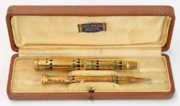 Parker Duofold fountain pen and mechanical pencil pair, the bodies decorated in engraved Aztec