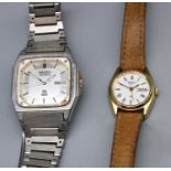 Seiko SQ 100 stainless steel quartz wristwatch with day date, signed brushed octagonal