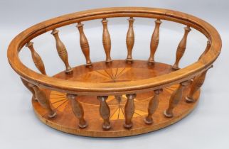 Early C20th wooden oval openwork bread basket, base inlaid with fan and star and with baluster