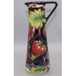 Moorcroft Pottery: Red Ribbons design jug designed by Shirley Hayes, tubelined decoration of red and