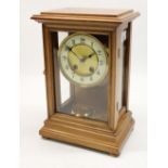 Early C20th mahogany four glass mantle clock, the dial having a matted centre and raised outer