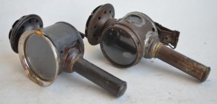 Two vintage candle powered Luxor Sterba bicycle lights, one with clear glass side panes