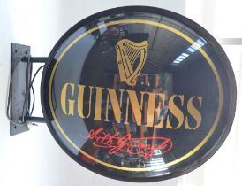 Large outdoor wall mounted Guinness advertising sign, metal rim and hardwearing plastic front and