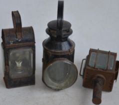 Three vintage railway lamps to include a BR(M) railwayman's lamp with slatted red, green and blue