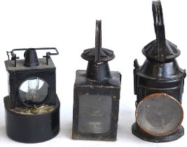 Three vintage railway lamps to include LMS and BR(M) stamped examples, larger signal lamp has no
