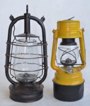 Two vintage German paraffin storm lamps to include a Bat lamp (metal body stamped Made In Thuringia,