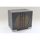 c1930s Art Deco speaker, the grey metal case with chromed reeded foot and central enamel 'NC'