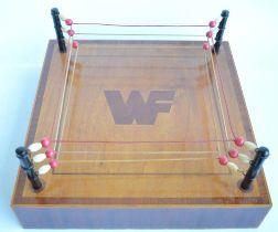 An interesting and well constructed homemade satinwood and mahogany miniature Wrestling Federation