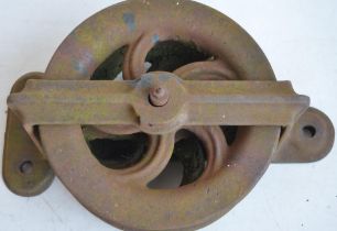 Heavy cast iron double pulley, marked BD.