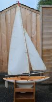 Large pond sailing sloop, fibreglass hull with metal mast and booms, not radio controlled. Overall