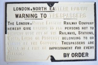 Partially restored original vintage cast iron LNER relief "Warning To Trespassers" sign, 66.5cm x