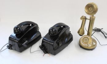Pair of Art Deco black bakelite telephones with hand crank operation and a brass stick telephone (3)