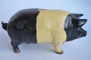 Large heavy vintage cast iron pig money bank (stopper missing). Approx dimensions L44xW17xH22cm