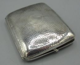 Geo.V hallmarked silver rectangular cigarette case, spot hammered with vacant cartouche, by S