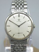 1960's Omega stainless steel hand wound wristwatch, signed silvered dial with applied baton hours