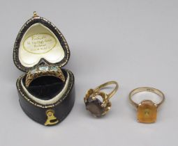 9ct yellow gold ring set with smoky quartz, size M, and two other 9ct gold rings, one set with