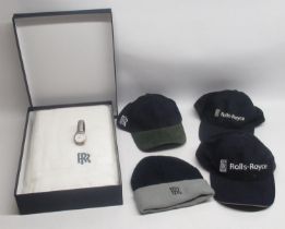 Three Rolls-Royce baseball caps, a Rolls-Royce beanie, a Rolls-Royce towel in original packaging and
